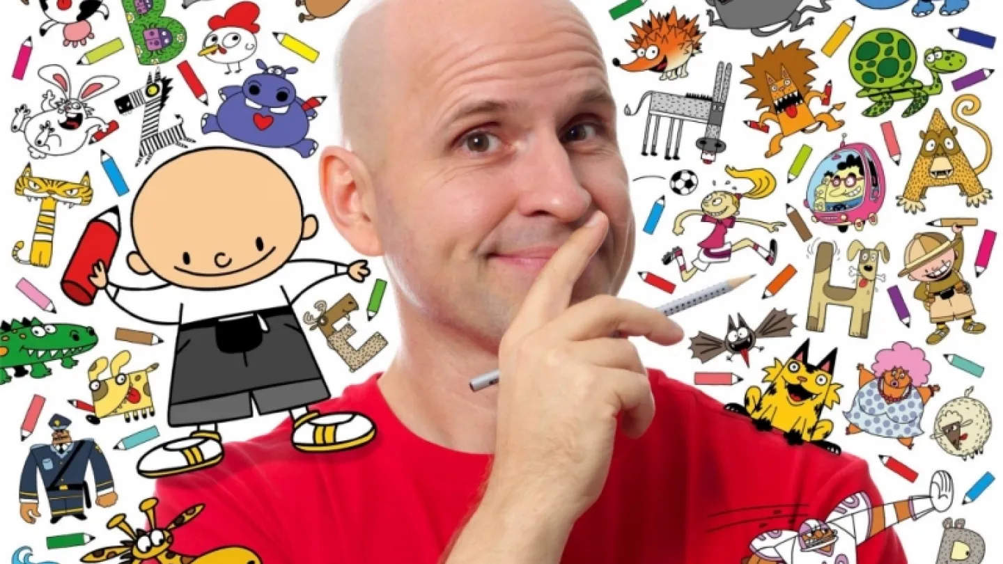 Bald man in a red shirt holds a pen to his chin, in front of a colorful doodle collage of animals and characters.