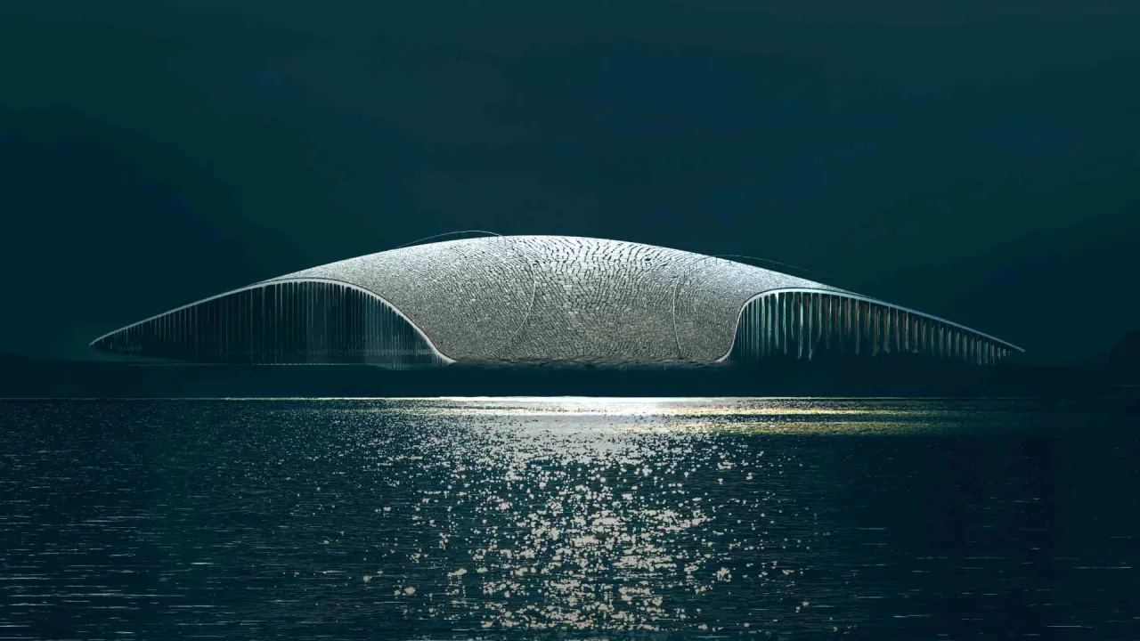 A sleek, dome-shaped structure hovers above dark water, with a bright reflection shimmering on the surface below.