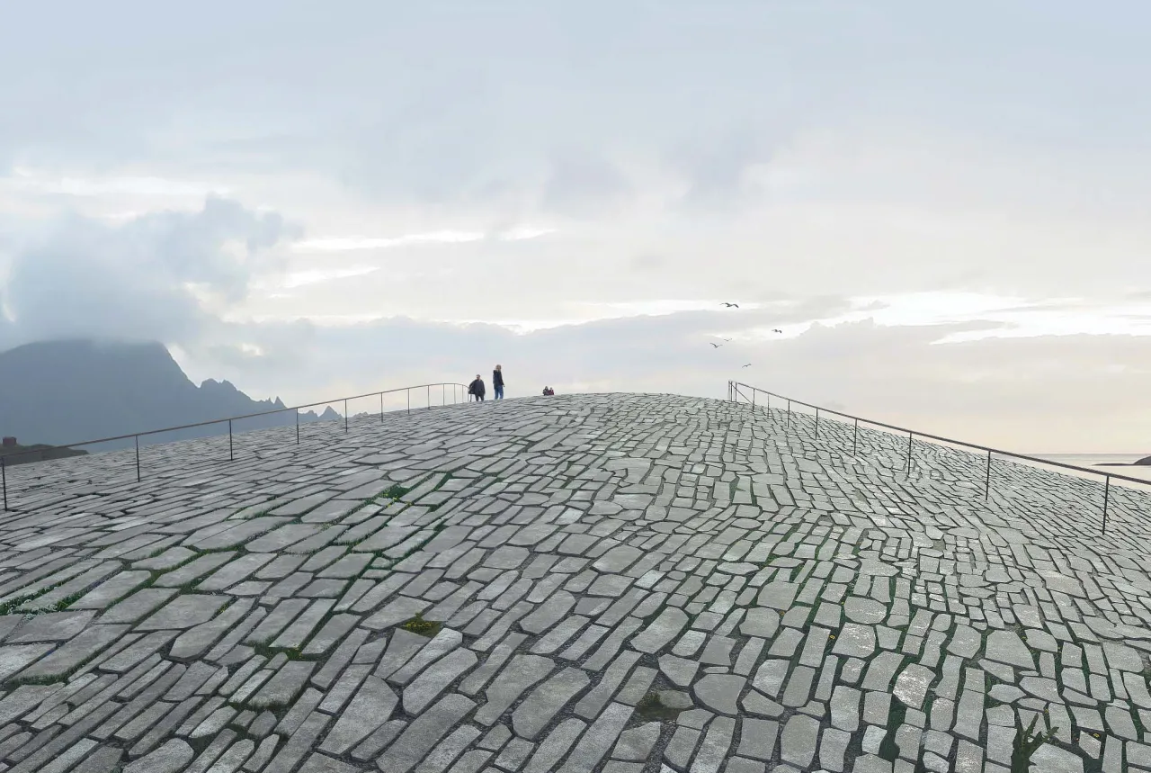 Wide stone-tiled walkway rises to a ridge with a few people, railings, distant mountains, and cloudy sky.