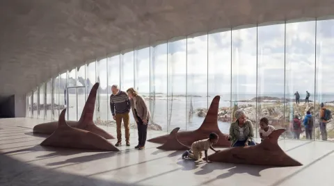 Sunlit museum gallery with large whale-shaped sculptures, visitors, and a panoramic glass wall overlooking the sea.