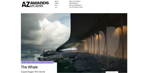 Website screenshot showing a long curved building with lit arches along a rocky shoreline under cloudy skies.