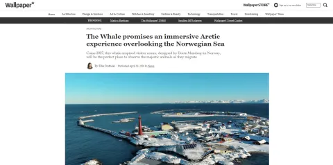 Screenshot of an online article above a photo of a snowy coastal town with a red lighthouse and harbor breakwaters.